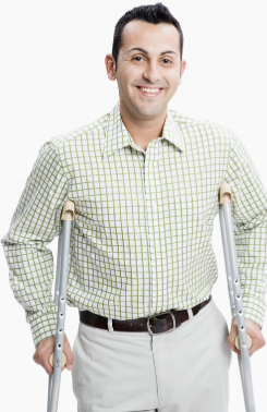 smiling man with metal crutches